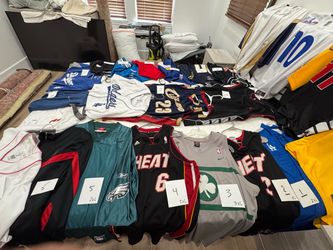 Large collection of sports jerseys