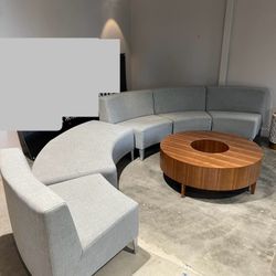 modular curved lounge set (multiple sections) + the large round wood coffee table