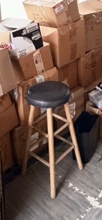 WOODEN BAR STOOL WITH BLACK PADDED SEAT
