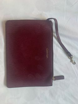 Calvin Klein burgundy zip wristlet pouch