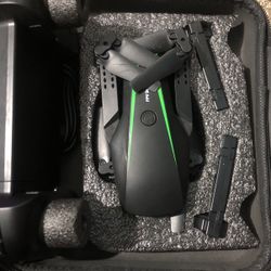 It has a drone with a card with the controller