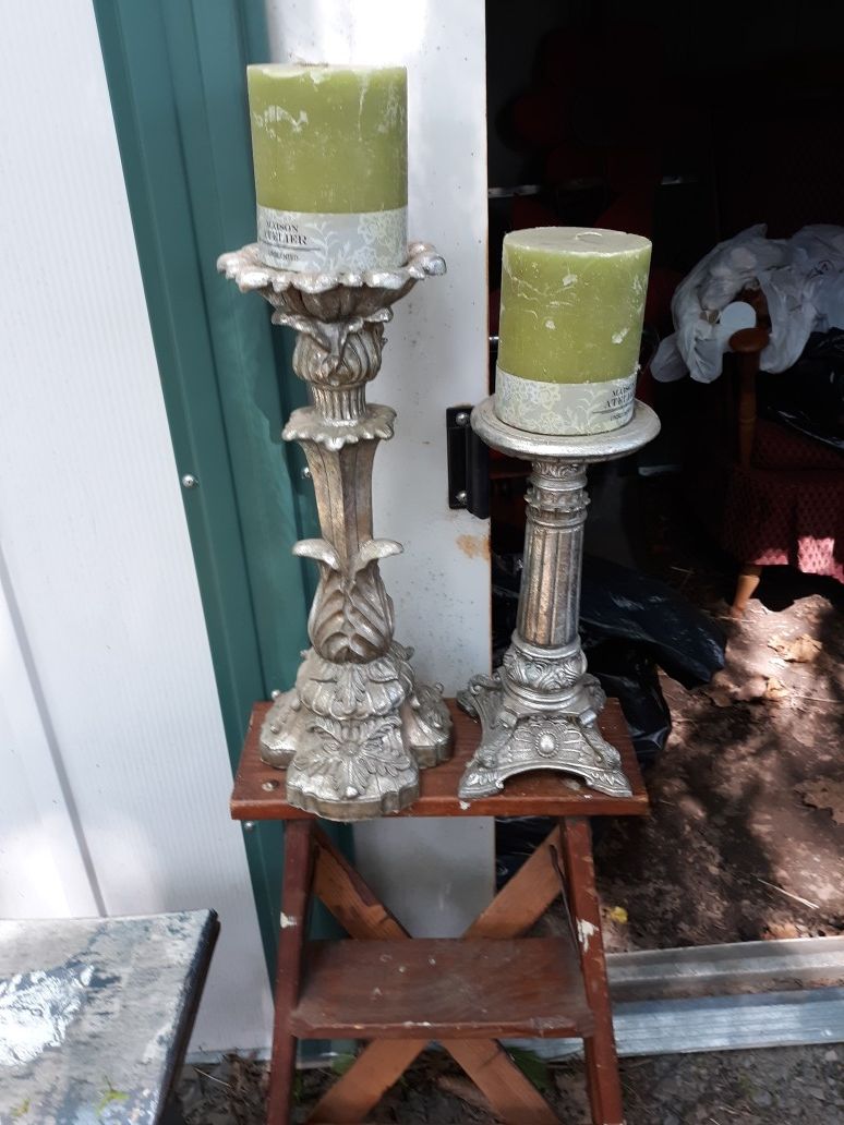 2 pillar candles holders with candles
