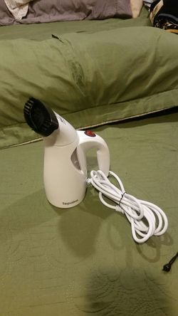 Travel garment steamer.