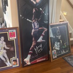 Three framed basketball photos great for decoration or man cave