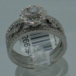 14kt white gold cluster ring with diamonds 1.38pts ( centered round diamond 0.30pts; 12 round diamonds 0.30pts; 78 small round diamonds 0.78pts) size 