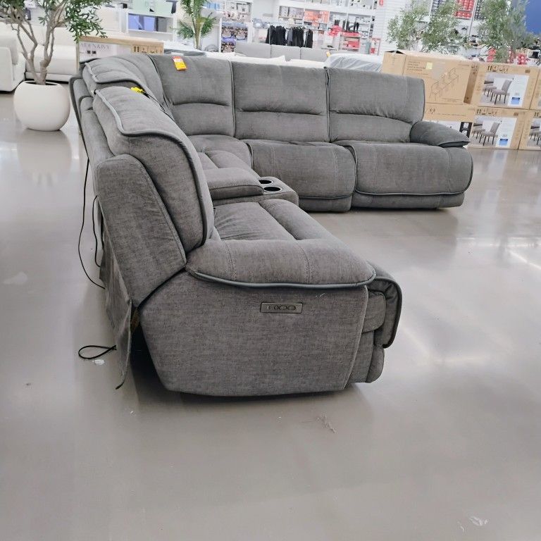 Grey fabric power reclining sectional sofa .