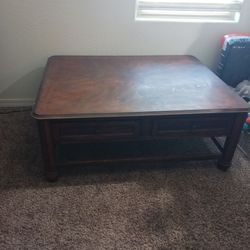 Clean solid wooden coffee table with drawers