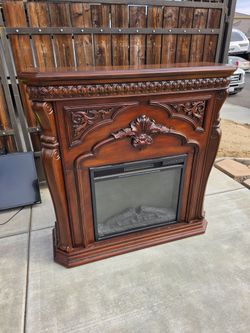 Electric Fireplace with Ornate Wood Mantel