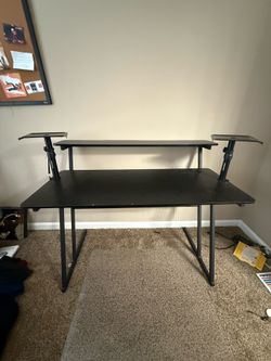 desk with speaker mounts