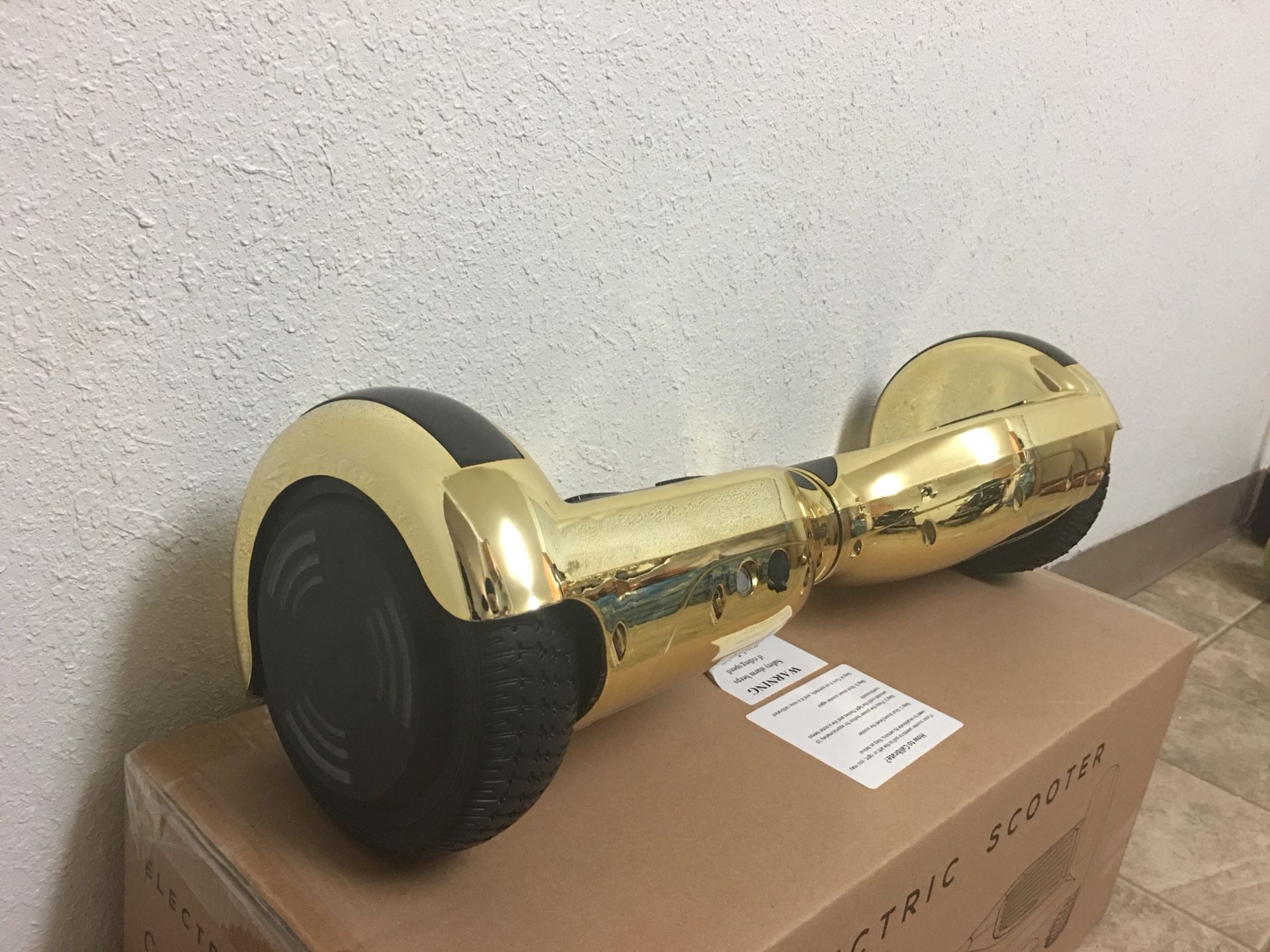 Brand new gold metallic hoverboard ( has Bluetooth to play music)