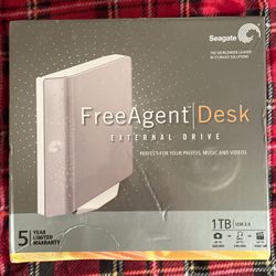 Seagate FreeAgent Desk 1 TB USB 2.0 Desktop External Hard Drive ST310005FDA2E1-RK (Silver)