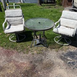Patio table, 2 chairs, cushions, and base