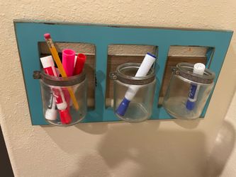 Wall mounted organizer with jars