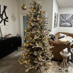 8ft artificial Christmas tree with snow