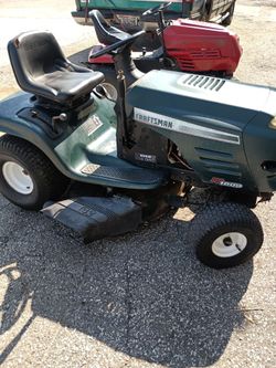 Two running Riding Lawn mowers
