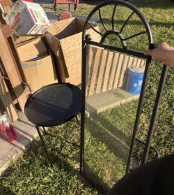 Black metal mirror and ikea side table