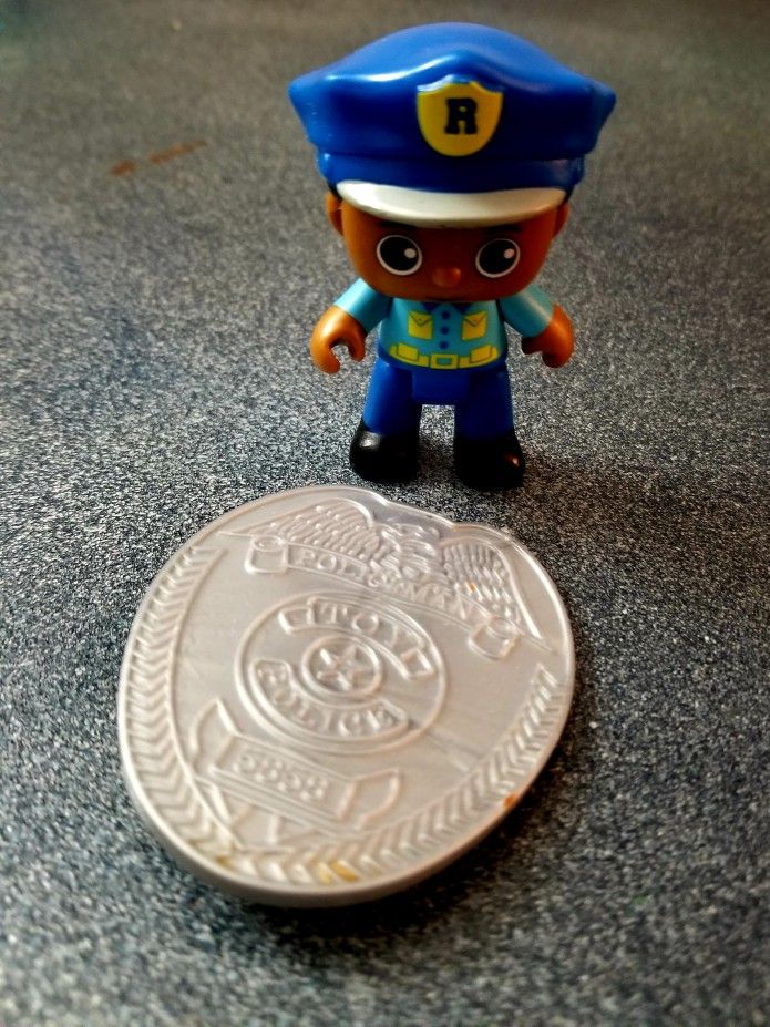 Police Figure and Toy Badge
