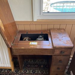 Antique Sewing Machine And Table