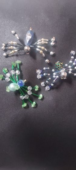 HANDMADE SPIDERS MADE WITH BEADS WEAR THEM AS PINS. $5.00 EACH