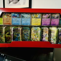 Pokemon Prismatic Evolutions Costco Tins 