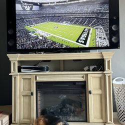 SONY 56inch flat Screen TV with FIRE PLACE/ TV STAND And PS5