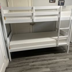 Hello yes. Available in white and espresso.  Triple bunk bed-$450 Twin 6” thick foam mattresses-$100 each   Assembly required. Assembly not included. 