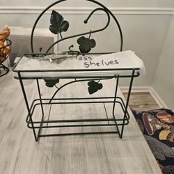 Wrought Iron With Glass Shelves  New Condition. 30 Obo