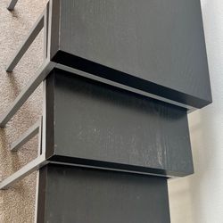 Side tables Stylish set of 3 nesting tables. Has dark wood-look tops with grey metal legs.