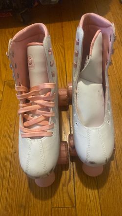 Pink and white rollerskates