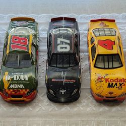 7 die cast 1:24 collectible race cars.  All 7 in one bundle. 