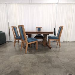 Oak Pedestal Dining Table with Four Upholstered Chairs