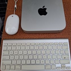 Apple Mac Mini Runningv Mac OS Monterey With Keyboard And Mouse.