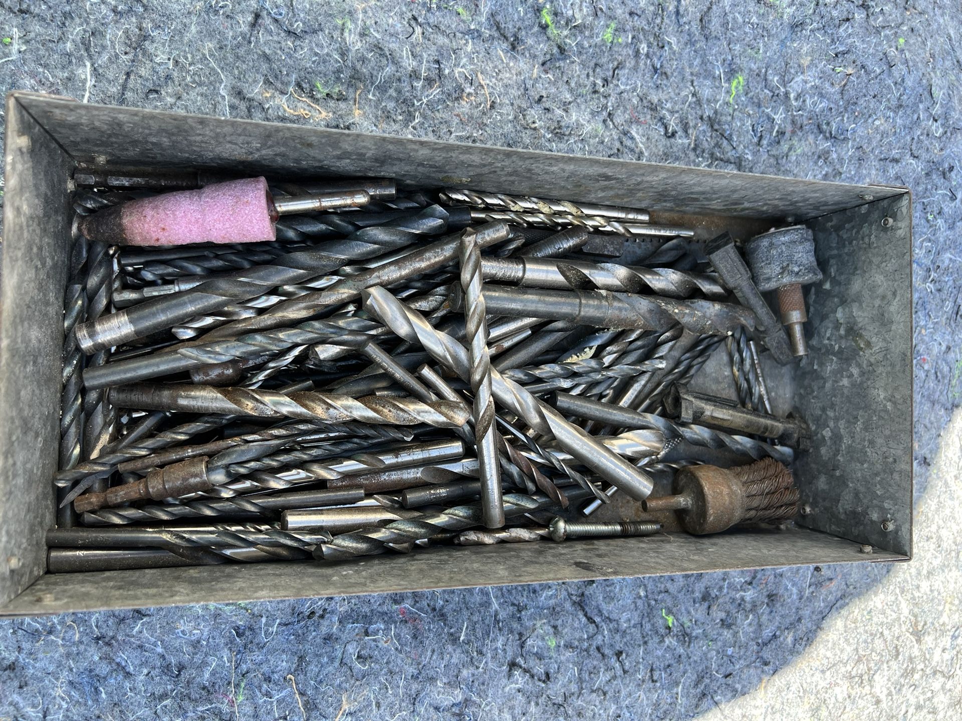 137 Assorted Drill Bits, 2 Stones, and 1 Wire Brush.
