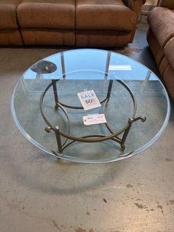 Round glass top coffee table (in store)