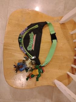 Ninja turtles fanny pouch and two toys