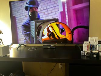 Samsung Large Flat Screen LED Smart TV 65 inches with Table (free) for $400