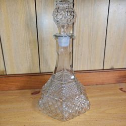 Clear glass Wexford decanter with matching glass Wexford stopper with a plastic end for the cork.