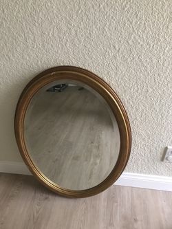 Gold leaf oval mirror