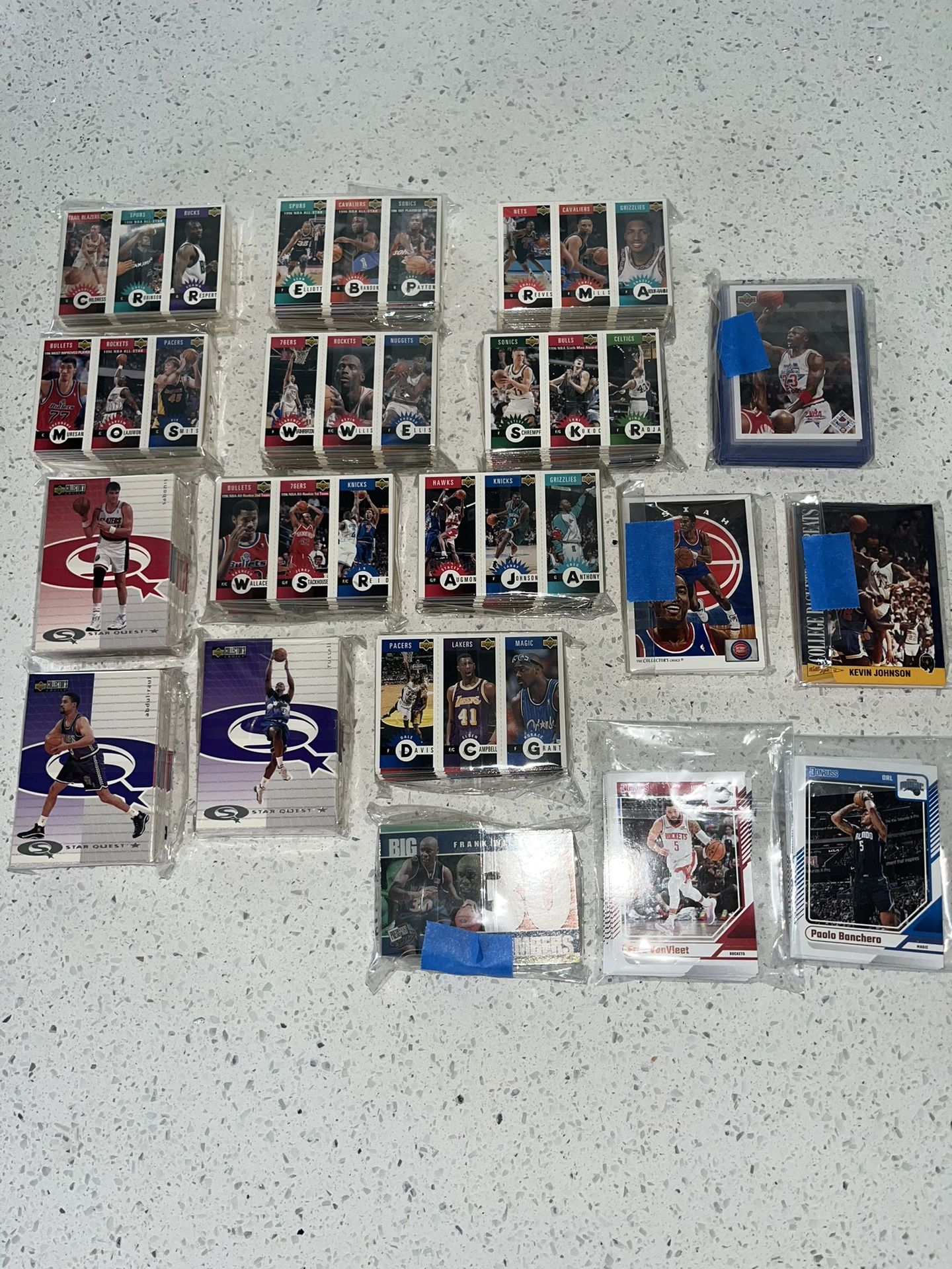 17 packages of basketball cards in bags