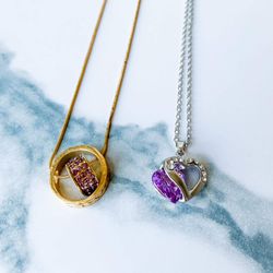 Two necklaces with purple gemstones
