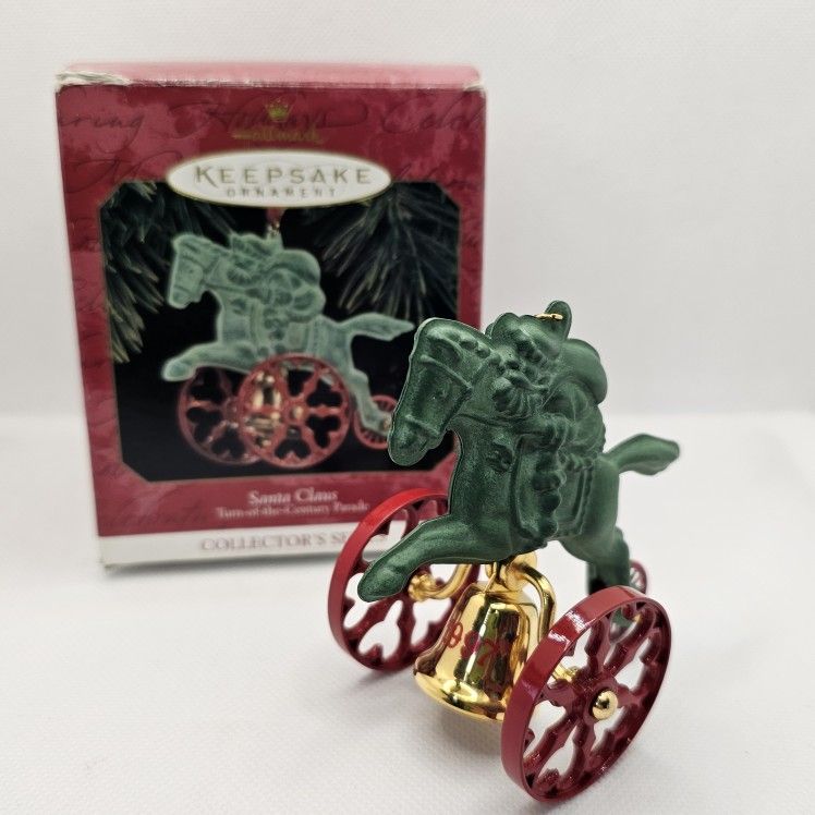 1997 Hallmark Keepsake Ornament Santa Claus Turn Of The Century Parade Series

3rd in the series
Die cast metal and brass
Dated 1997

Ornament is in g