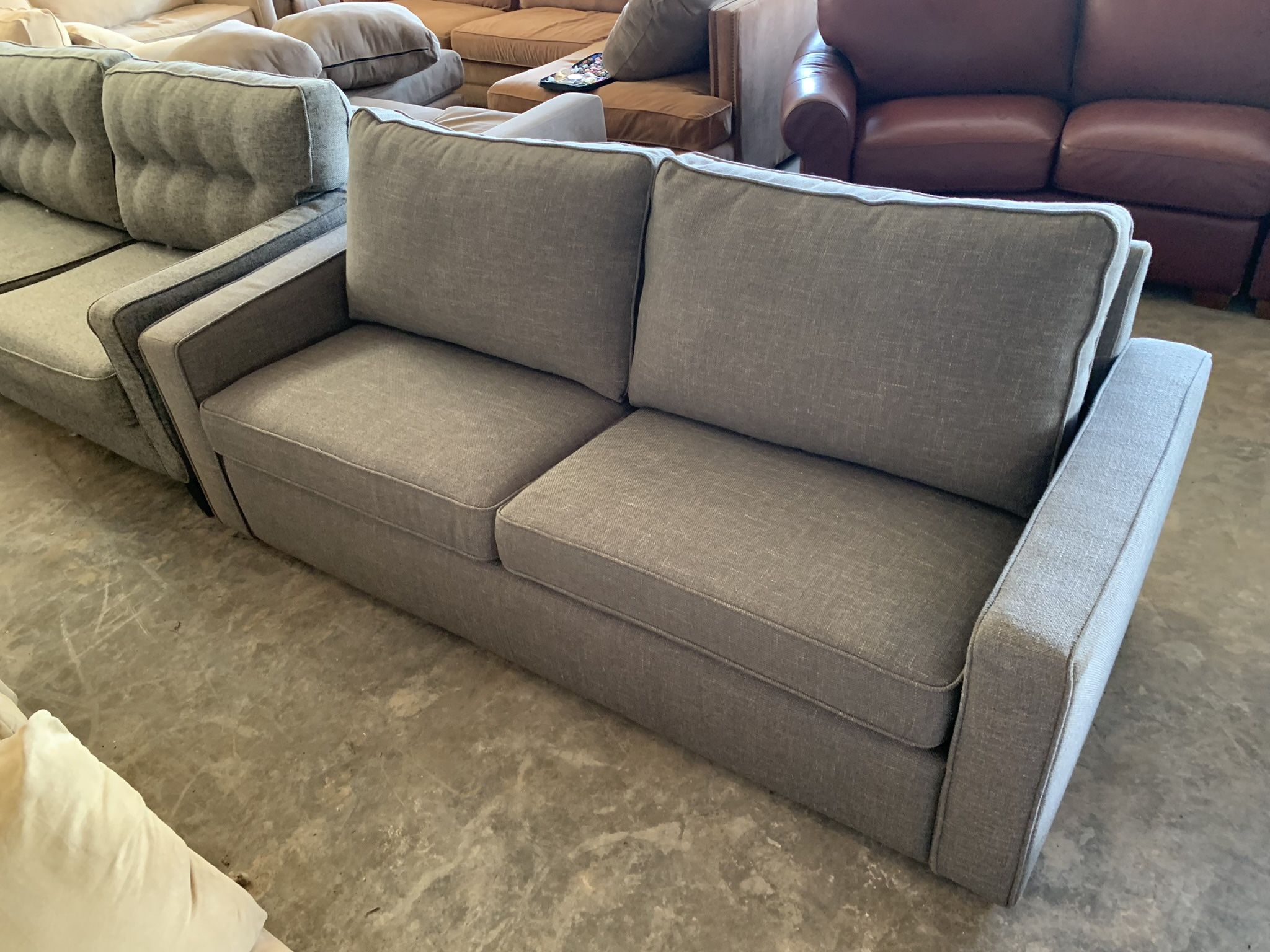 Grey Couch “WE DELIVER”