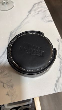 4 Round coasters with the In-N-Out burger logo debossed on top.