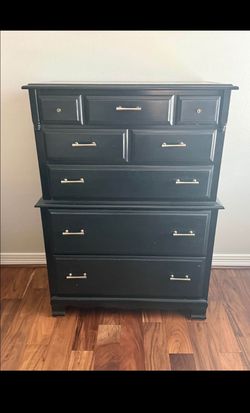 Tall black dresser with matching nightstand