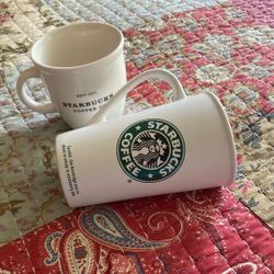 Two Starbucks mugs