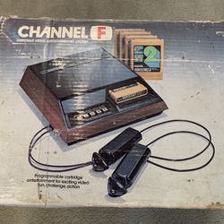 Boxed Fairchild Channel F vintage video game console with games