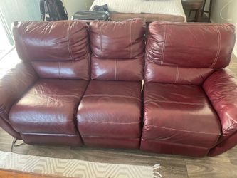 Reclining leather couch and matching recliner