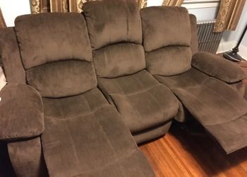 Three seat reclinable couch with drop down cup holders