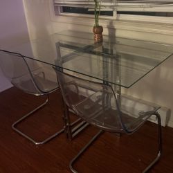 Glass Table And  2 Plexiglass Chairs 