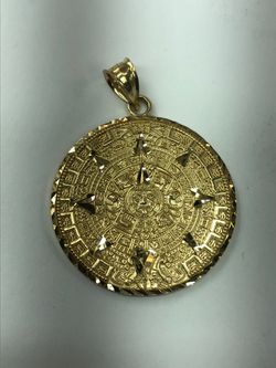 14k gold not fake or plated charm Aztec calendar Rafaela jewelry located at 758 south Broadway la ca 90014. we are open 7 days a week from 10.45 to